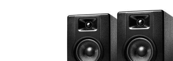 Pair of black audio playback equipment speakers delivering clear and detailed sound for critical monitoring