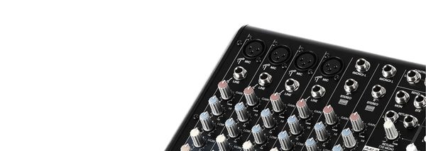 Professional recording and mixing equipment audio mixer with multiple input channels and control knobs