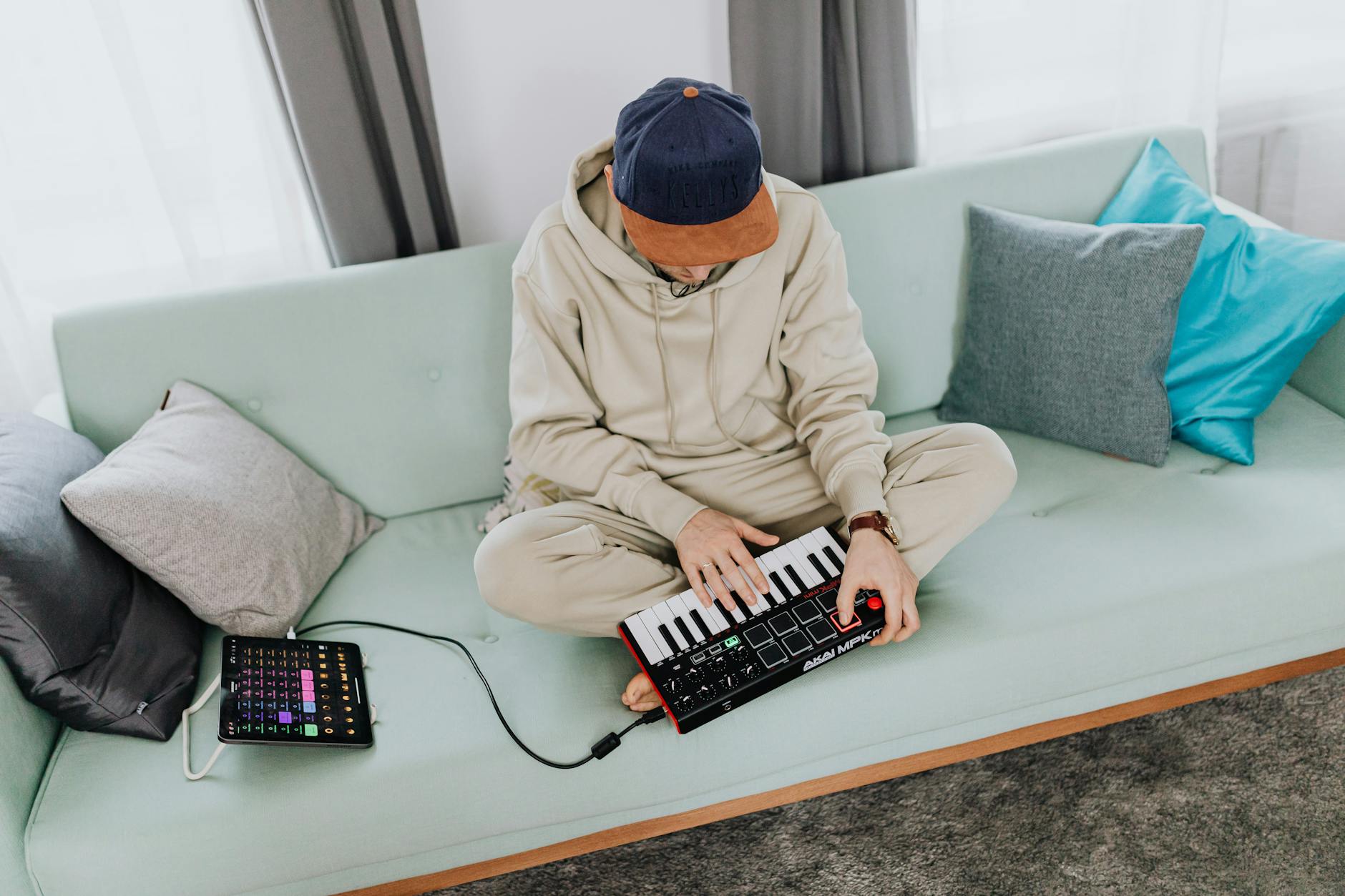 Akai MPK Mini MIDI controller in use for music production lifestyle commercial shot