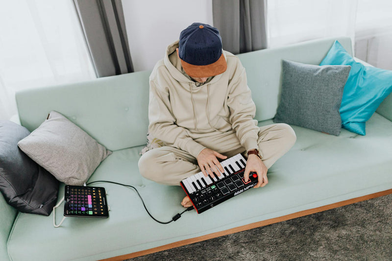 Akai MPK Mini MIDI controller in use for music production lifestyle commercial shot